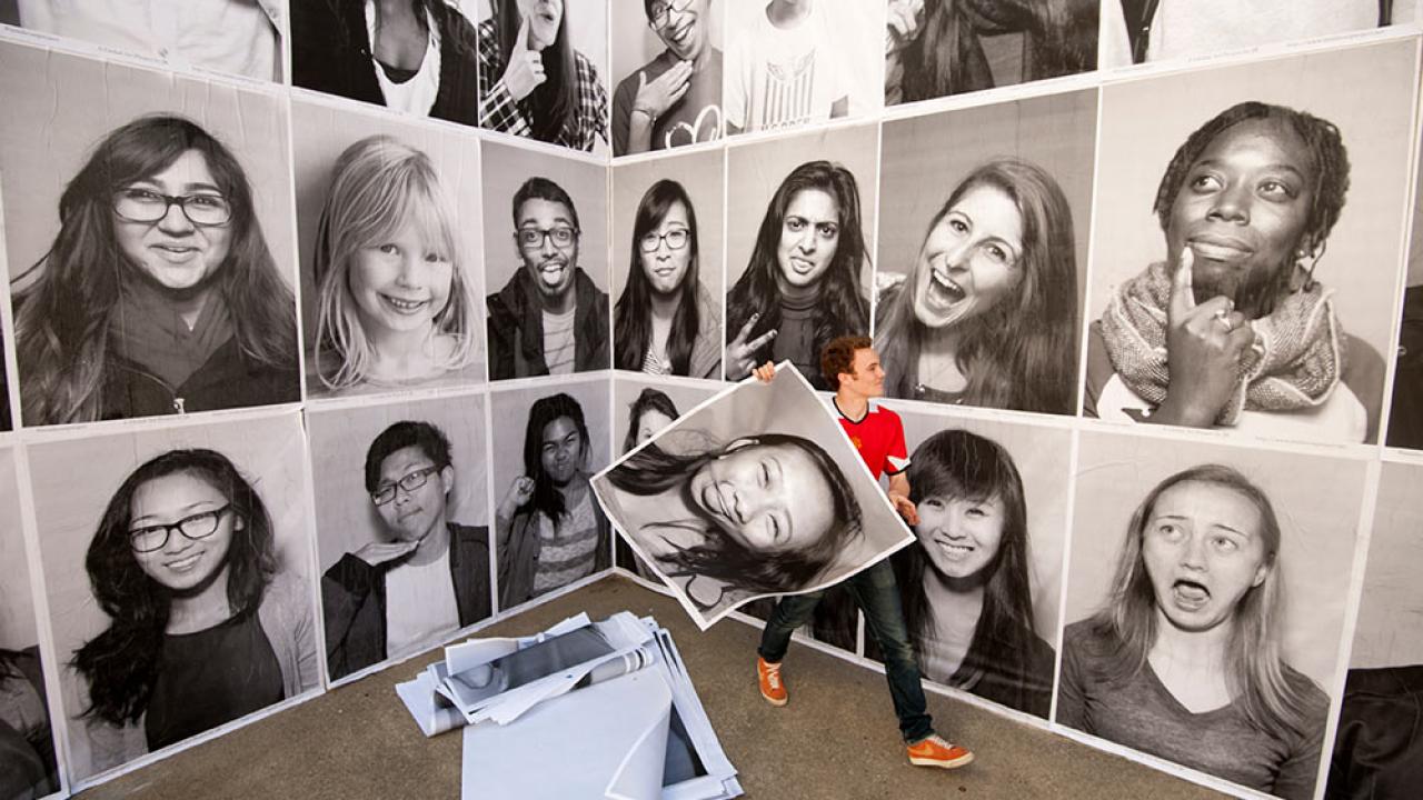 student portraits hung by student