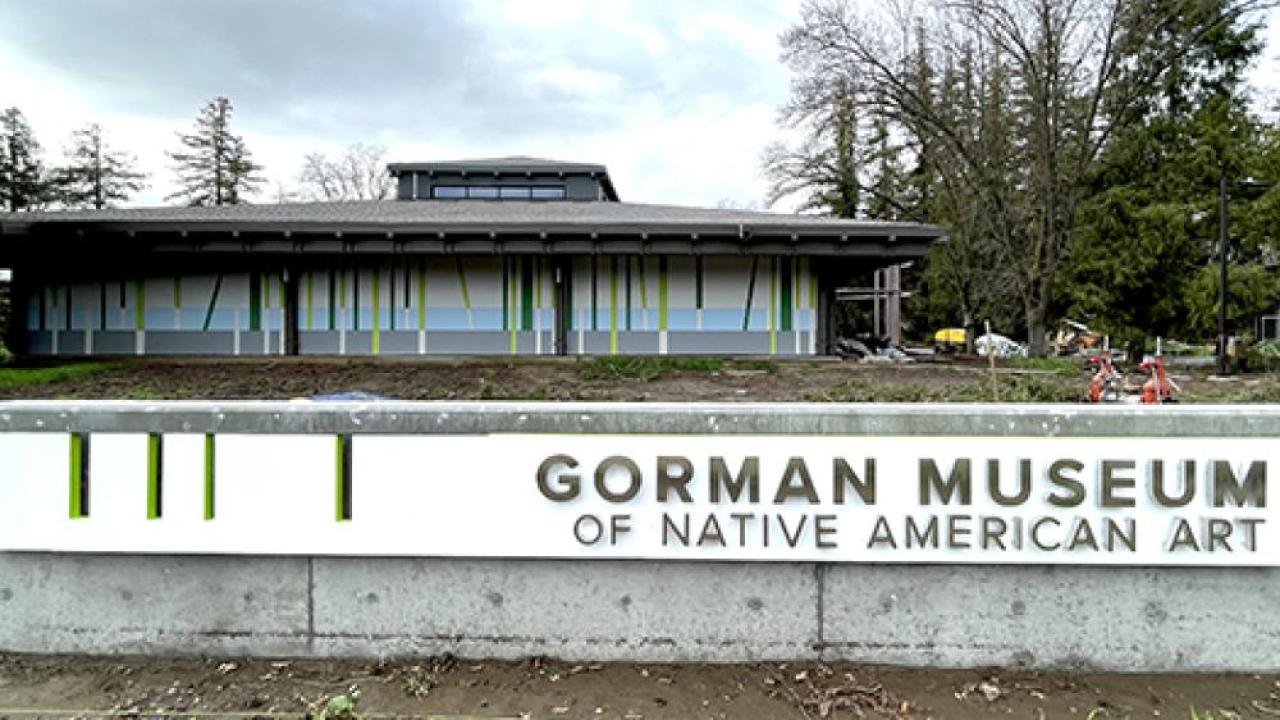 A white museum sign that reads "Gorman Museum of Native American Art" is pictured in front of the renovated museum.