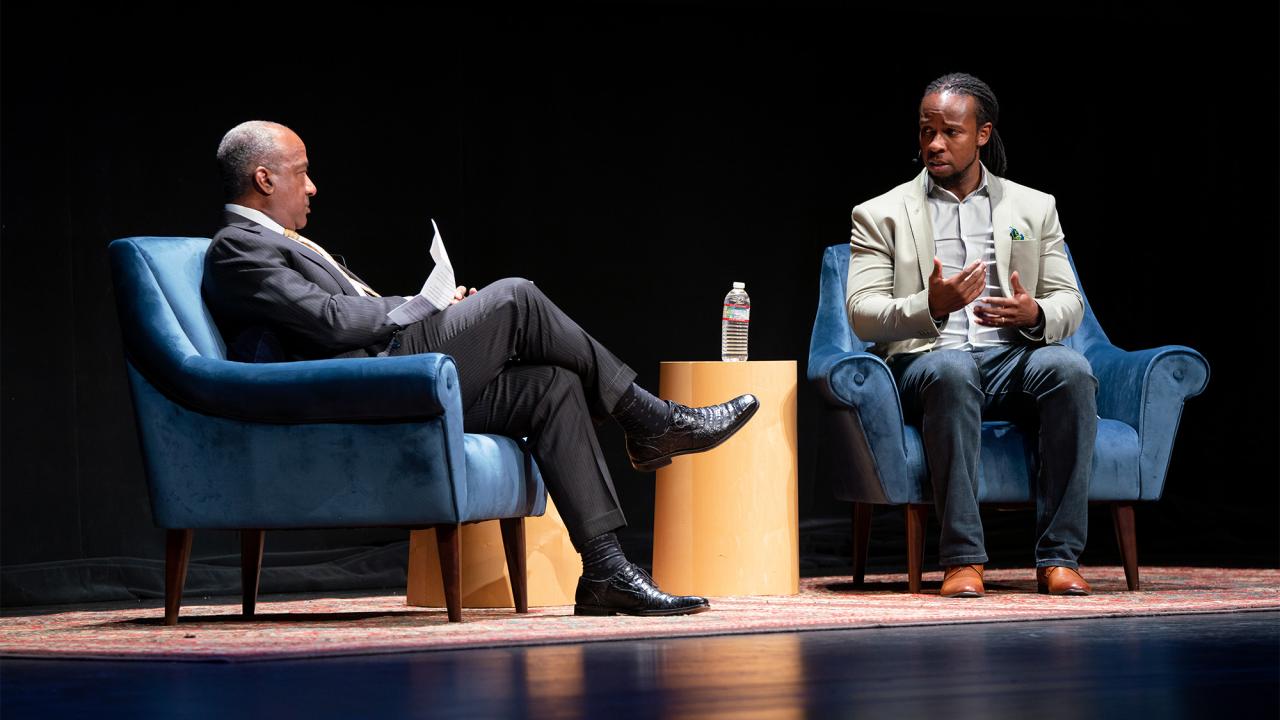 Ibram X. Kendi talks to Chancellor Gary S. May on stage