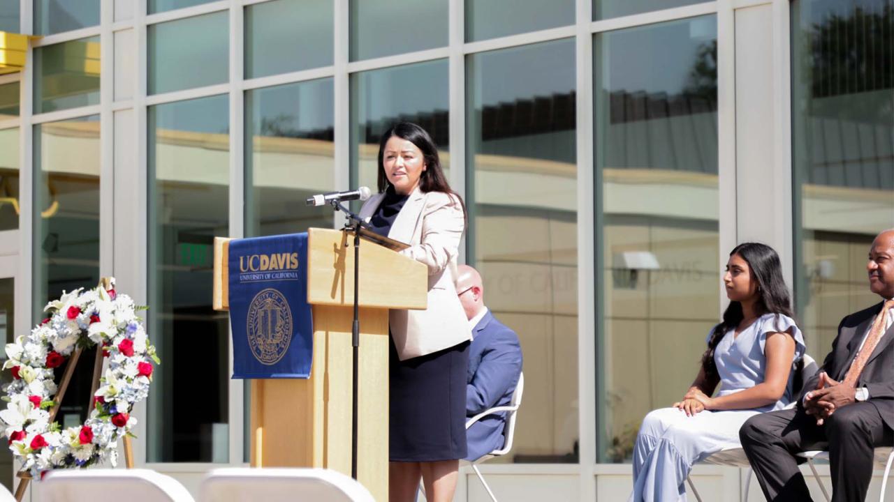 Xóchitl Rodriguez Murillo speaks on stage at event.