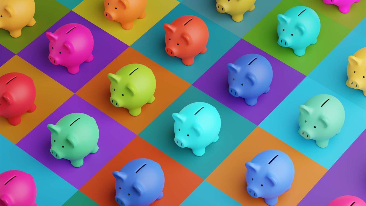 Piggy banks of multiple different colors.