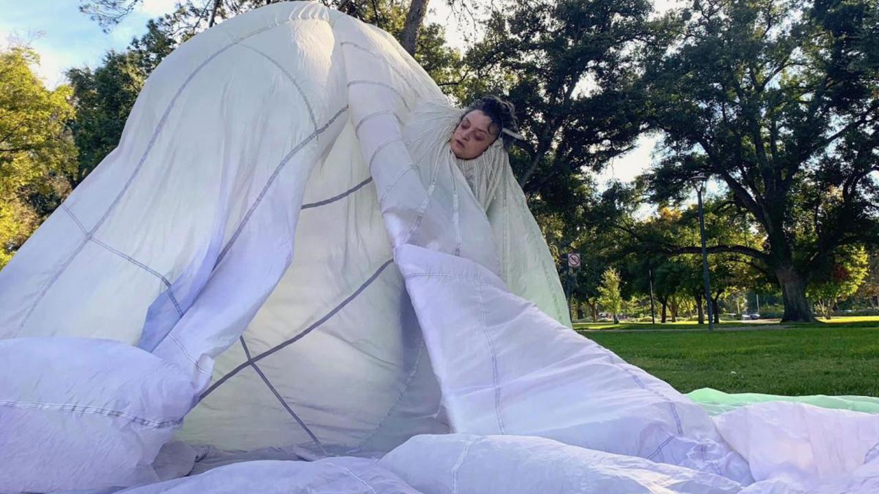 Woman wearing parachute-type garment