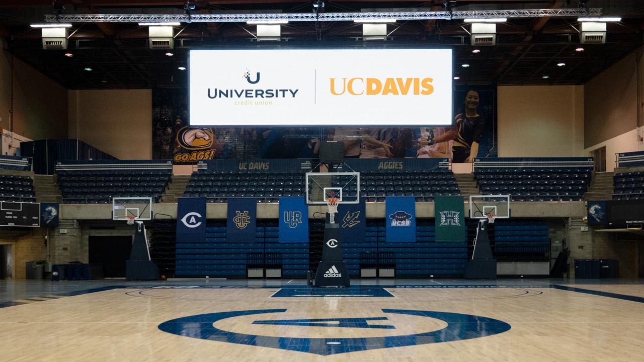 Videoboard hangs in The Pavilion, which will become the University Credit Union Center on july 1, showing the credit union logo and UC Davis wordmark.