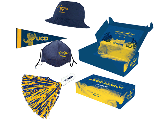 Different items of UC Davis swag including a mask, spirit box, pompom and bucket hat