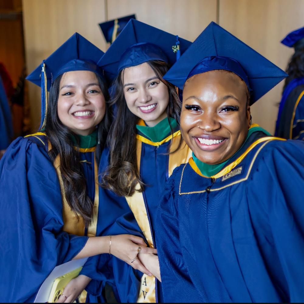 portrait of three graduates