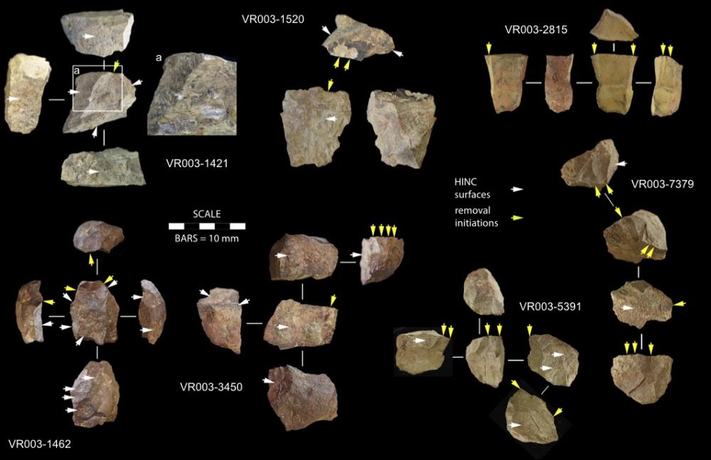 Archaeological collection of stone fragments arranged on a black background. 