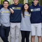 Four UC Davis students in engineering college T-shirts standing together