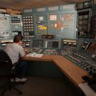 Cyclotron operator in control room.