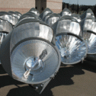 Photo shows part of one of the banks of lights, prior to
being hoisted into place. A Musco Lighting spokesman said the reflectors
within each fixture are customized for that light, ensuring that the beam
goes &ldquo;where we want it go.&rdquo; The re