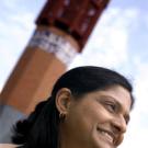 Photo: woman's profile with mosque in background