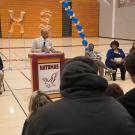 UC Davis Chancellor Gary S. May speaks to high school students in a gym