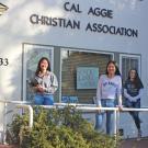 Three women pose on front porch of Cal Aggie Christian Association house.