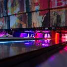 Bowling lanes with colorful lights.