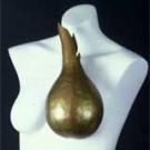 Photo: Mannequin with brass art over one breast