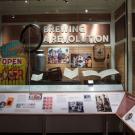 Display case with "Brewing a Revolution" title, along with artifacts.
