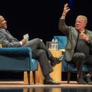 Chancellor Gary S. May laughs as William Shatner gestures.