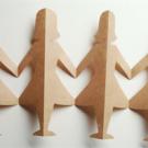 Photo: four female paper doll cutouts