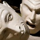 Yin & Yang, Robert Arneson's sculpture duo of two Eggheads, with one talking at the other, which is lying on its ear