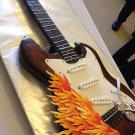 Part of a cake in the shape of an electric guitar