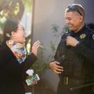 Songli Wang speaks with UC Davis police officer Jose Pinedo.