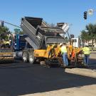 Workers repave intersection.