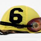 A numbered (6) jockey hat with goggles