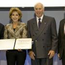 Photo: Chancellor Katehi holds certificate, while one of three other dignitaries holds medal.