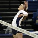 Volleyball player Lauren Matias jumps for the ball.