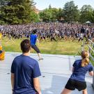 Photo: ARC staffers lead mass warmup, hundreds and hundreds of people on the Quad.
