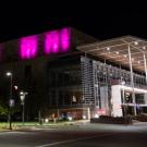 Purple lights at night on Mondavi Center's south wall