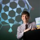 Photo: Colin Milburn, holding his new book, "Mondo Nano: Fun and Games in the World of Digital Matter."