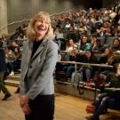 Professor Anita Oberbauer, smiling, in front of lecture hall filled with students.