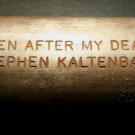 Metal container with engraving: "Open After My Death, Stephen Kaltenbach"