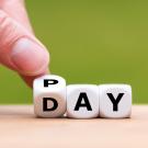 "Pay Day" spelled out on dice.