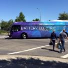 Bus has a wrap that reads "Battery Electric."