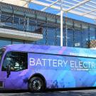 A purple and blue bus reads: Proterra Catalyst battery electric.