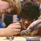 Photo: two guys involved in tool work