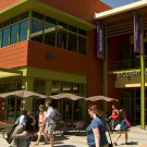 Student Community Center exterior, with people walking by