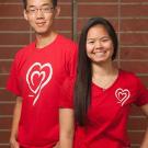 Photo: Two students model UC Davis Wears Red Day T-shirts.