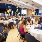 Luncheon event, circular tables with balloons, in Freeborn Hall