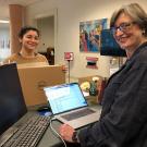 Student picks up laptop at library.