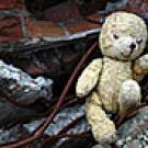 Photo: teddy bear in rubble