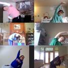 Screenshot of video conference call showing children stretching.