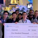 Students pose with a $500,000 check in Las Vegas.