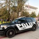 A UC Davis Police car outside Mrak Hall.
