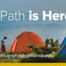 "UCPath is Here!" graphic shows a campsite with tents.