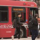 Students board a Unitrans bus.