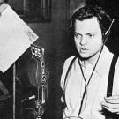 Orson Welles at radio microphone