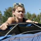 Photo: May Wilson installs her whale art.