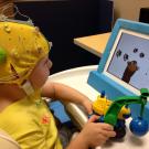 Deaf child taking EEG test